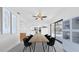 Stylish dining room features modern lighting and a sliding glass door to the outdoors at 2116 Karan Way, Clearwater, FL 33763
