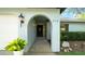 Arched entry with manicured landscaping at 2116 Karan Way, Clearwater, FL 33763
