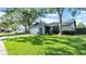 Charming single-story home with a well-maintained lawn and beautiful curb appeal at 2116 Karan Way, Clearwater, FL 33763