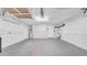 Spacious garage featuring pegboard walls, high ceilings, and ample storage space for tools and equipment at 2116 Karan Way, Clearwater, FL 33763