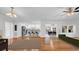 The open-concept living area features hardwood floors, seamlessly connecting the dining and kitchen spaces at 2116 Karan Way, Clearwater, FL 33763