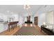 Spacious living area has hardwood floors, fireplace and natural light, flowing into the kitchen and dining room at 2116 Karan Way, Clearwater, FL 33763