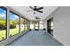 Screened patio with dual ceiling fans, an exterior entrance, and lots of natural light at 2116 Karan Way, Clearwater, FL 33763