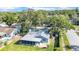 A backyard view of this inviting house featuring a screened in porch and fenced yard at 2116 Karan Way, Clearwater, FL 33763
