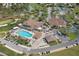 Aerial view of a community clubhouse with a pool and golf course at 2235 Lytham Ct, Spring Hill, FL 34606