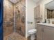 Remodeled bathroom includes walk-in shower with grab bars and granite-style tile at 2235 Lytham Ct, Spring Hill, FL 34606