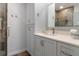 Bathroom featuring stylish gray vanity with white countertop and modern shower at 2235 Lytham Ct, Spring Hill, FL 34606