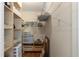 This walk-in closet provides an abundance of storage shelves and hanging space at 2235 Lytham Ct, Spring Hill, FL 34606
