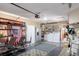A well-equipped garage featuring a utility sink, laundry area, shelving, and workshop space at 2235 Lytham Ct, Spring Hill, FL 34606