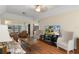 Comfortable living room with wood floors, neutral colors and plenty of natural light at 2235 Lytham Ct, Spring Hill, FL 34606