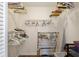 A walk-in closet boasts ample storage space with multiple hanging racks and shelves at 2235 Lytham Ct, Spring Hill, FL 34606