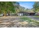 Charming single-story home with well-maintained landscaping and a spacious driveway at 2254 Coachman Rd, Spring Hill, FL 34608