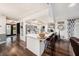 Bright, open kitchen with a large island, stainless steel appliances, and hardwood floors at 2254 Coachman Rd, Spring Hill, FL 34608