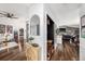 Inviting living space with seamless flow, connecting the dining area to the cozy living room with wood flooring at 2254 Coachman Rd, Spring Hill, FL 34608