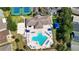 An aerial perspective of the clubhouse, pool, and other community amenities for an active lifestyle at 2325 Pleasant Hill Ln, Holiday, FL 34691