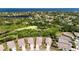 Home featuring lush greenery and a pond view in a desirable location near the ocean at 2325 Pleasant Hill Ln, Holiday, FL 34691