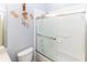Bathroom featuring a shower with sliding glass doors and blue walls at 2325 Pleasant Hill Ln, Holiday, FL 34691