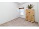 Serene bedroom showcases a neutral color palette and features plush carpeting and dresser at 2325 Pleasant Hill Ln, Holiday, FL 34691