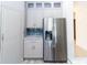 Modern kitchen with stainless steel refrigerator, sleek countertops, and plenty of cabinet space at 2325 Pleasant Hill Ln, Holiday, FL 34691