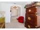 Spacious living room with arched entryway, tiled flooring, and an elegant chandelier at 2325 Pleasant Hill Ln, Holiday, FL 34691