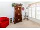 Bright living room boasts plantation shutters, plush carpeting and a unique armoire at 2325 Pleasant Hill Ln, Holiday, FL 34691