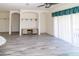 Open-concept living area with recessed lighting and sliding glass doors for easy access to outdoor living at 2325 Pleasant Hill Ln, Holiday, FL 34691