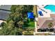 Aerial shot of playground near pool featuring a covered play area with various recreational equipment at 2325 Pleasant Hill Ln, Holiday, FL 34691