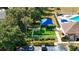 A well-maintained playground with vibrant equipment nestled in a lush, green community space at 2325 Pleasant Hill Ln, Holiday, FL 34691