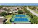 Community tennis courts with beautiful landscaping and nearby parking at 2325 Pleasant Hill Ln, Holiday, FL 34691