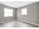 Bedroom with two windows and new laminate flooring at 27198 Simona Ave, Brooksville, FL 34602