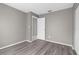 Bedroom with a door, light wood floors, and neutral wall color at 27198 Simona Ave, Brooksville, FL 34602
