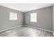 Cozy bedroom with two windows and new laminate flooring at 27198 Simona Ave, Brooksville, FL 34602
