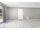 Open-concept living area with tile floors and lots of natural light, offering a bright and airy feel at 27198 Simona Ave, Brooksville, FL 34602