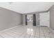 Bright living room with tile flooring, with a large window, and ample space, creating a clean and welcoming atmosphere at 27198 Simona Ave, Brooksville, FL 34602
