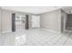 Spacious living area with large, light-bearing window and tile flooring, providing a bright and welcoming atmosphere at 27198 Simona Ave, Brooksville, FL 34602