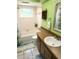Bright bathroom with a tub, shower, and wood vanity at 273 Gulfport Ln, Spring Hill, FL 34608