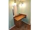 Bathroom vanity with wood cabinetry and decorative lighting at 273 Gulfport Ln, Spring Hill, FL 34608