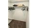 Walk-in closet with clothes hangers and storage shelf at 273 Gulfport Ln, Spring Hill, FL 34608