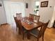 Bright dining area with wood table, seating for six and sliding glass doors at 273 Gulfport Ln, Spring Hill, FL 34608