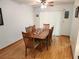 Inviting dining room with wood floors and a large window with natural light at 273 Gulfport Ln, Spring Hill, FL 34608