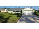 Charming single-story home with a well-manicured lawn and a two car garage at 273 Gulfport Ln, Spring Hill, FL 34608