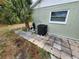 Outdoor AC unit with palm tree, offering energy efficiency and tropical flair at 273 Gulfport Ln, Spring Hill, FL 34608