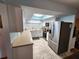 Bright kitchen with white cabinetry, stainless steel appliances, and a skylight at 273 Gulfport Ln, Spring Hill, FL 34608