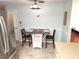 Kitchen area with stainless steel appliances, a tile floor, and a breakfast table at 273 Gulfport Ln, Spring Hill, FL 34608