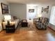 Comfortable living area with hardwood floors, lots of light, with neutral wall colors at 273 Gulfport Ln, Spring Hill, FL 34608