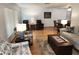Spacious living room with hardwood floors and windows for plenty of sunlight at 273 Gulfport Ln, Spring Hill, FL 34608