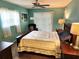 Cozy main bedroom featuring a ceiling fan and ample natural light at 273 Gulfport Ln, Spring Hill, FL 34608