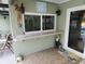 Outdoor patio with a serving area and a pass through window at 273 Gulfport Ln, Spring Hill, FL 34608