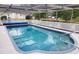 Enjoy this screened pool with ample space for entertaining and a sunny spot for relaxation at 273 Gulfport Ln, Spring Hill, FL 34608