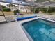 Backyard screened pool to enjoy the fresh air, ample sun, and a great spot to relax with friends at 273 Gulfport Ln, Spring Hill, FL 34608